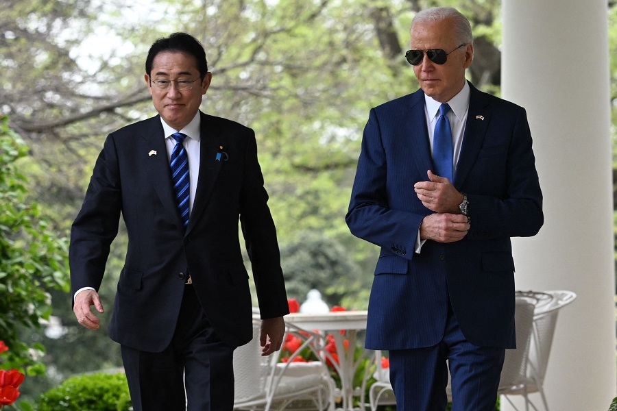 US President Joe Biden and Japanese Prime Minister Fumio Kishida arrive for a joint press conference in the Rose Garden of the White House in Washington, DC, 10 April 2024. (Saul Loeb/AFP)