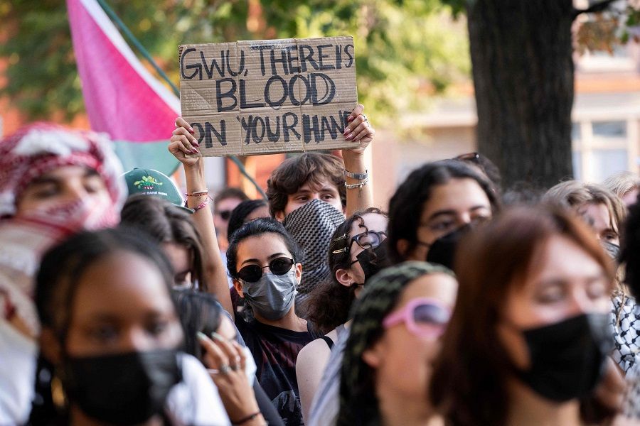 Pro-Palestinian protesters and some students from the George Washington University participate in a protest in downtown Washington, DC, on 22 August 2024. (Roberto Schmidt/AFP)