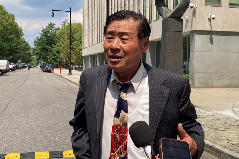 Chinese-American academic Wang Shujun speaks to the press after being convicted in Brooklyn federal court on charges of acting as an illegal agent of China's government, in New York