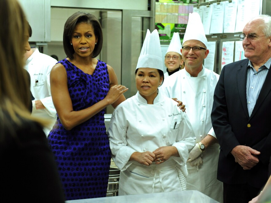 First Lady Michelle Obama greets Comerford as she talks to visiting culinary students in 2009.