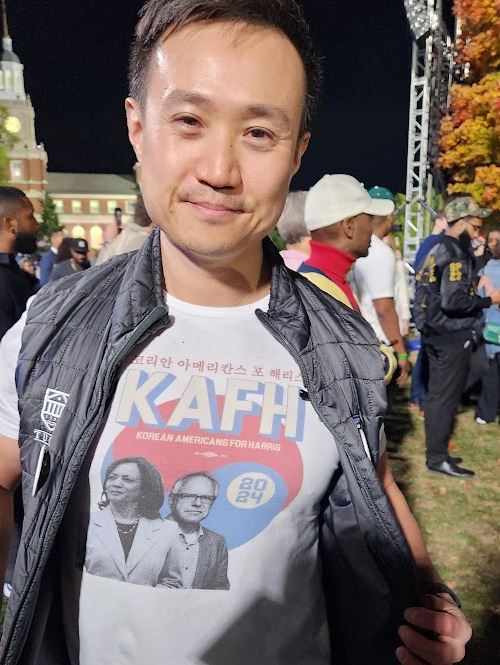 Dan Lee of Korean Americans for Harris shows off his Kamala Harris t-shirt 