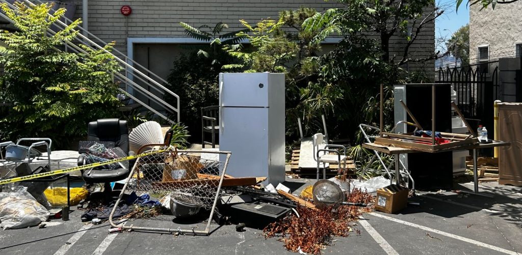 Debris littered the grounds outside the former Sakura Intermediate Care Facility in June 2024. Following orders from the city, the grounds have since been cleaned up and graffiti has been removed.  