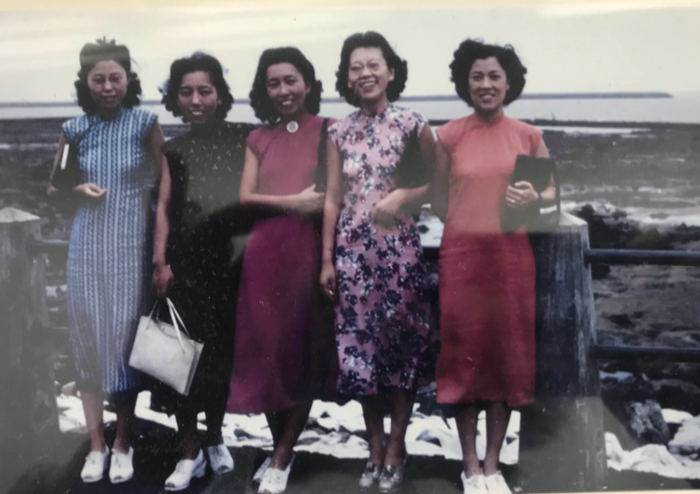 A group of women posing for a photo

Description automatically generated