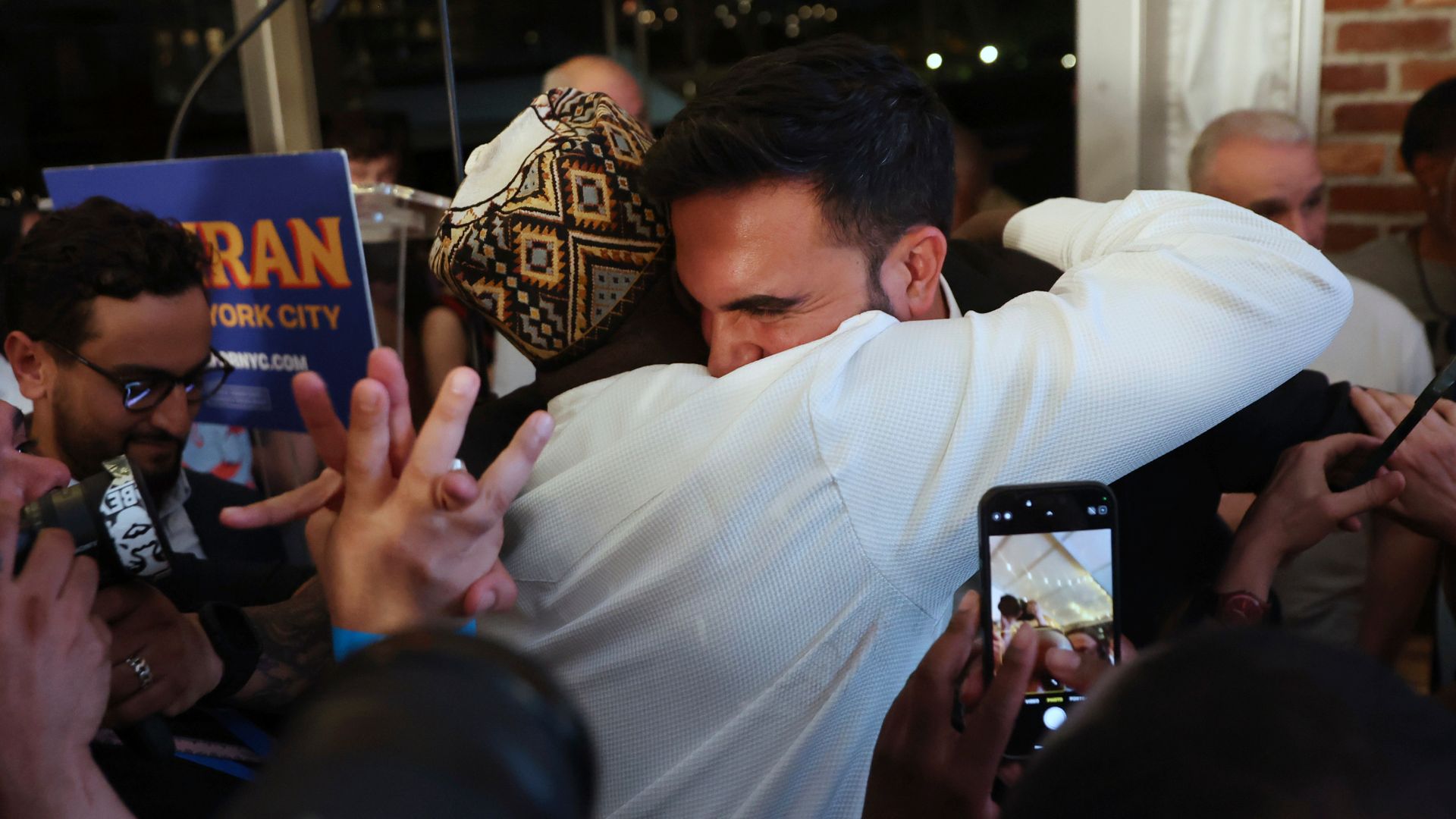 Democratic mayoral candidate Zohran Mamdani hugs supporters after speaking at his primary election party, Wednesday, June 25, 2025, in New York.