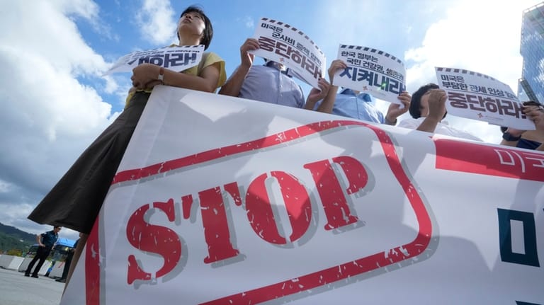 Members of civic groups protest against U.S. President Donald Trump's...