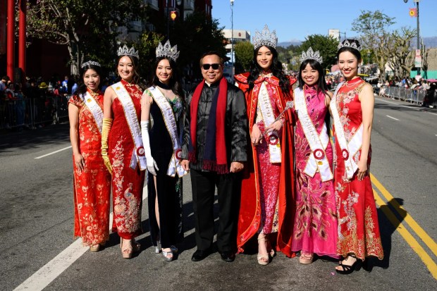 President of the Chinese Chamber of Commerce Chester Chong (center) poses with Los Angeles Chinatown Royalty during the 127th Annual Golden Dragon Parade on Saturday, Feb. 21, 2026. (Photo by Jacob Lewis, Contributing Photographer)
